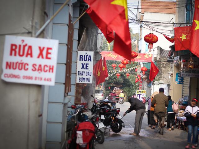 Tài chính - Bất động sản - Rửa xe ở quê ngày Tết: Một ngày công bằng vài tạ thóc