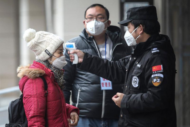Trung Quốc lý giải nguyên nhân số bệnh nhân mắc Virus Corona mới tăng đột biến - 1
