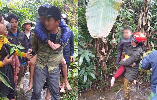 Người dân cùng lực lượng chức năng đưa hai cháu bé ra khỏi rừng sau 1 đêm đi lạc
