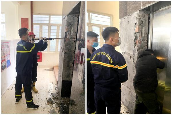 Công an thị xã Quảng Yên phá dỡ một phần thang máy để đưa thi thể nạn nhân ra ngoài. Ảnh: K.N