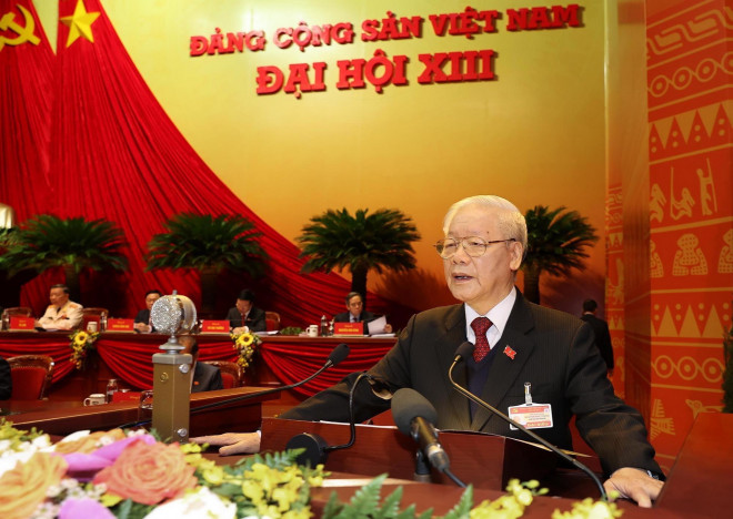 Tổng Bí thư, Chủ tịch nước Nguyễn Phú Trọng đọc Báo cáo chính trị của Ban Chấp hành Trung ương khóa XII và các văn kiện trình Đại hội