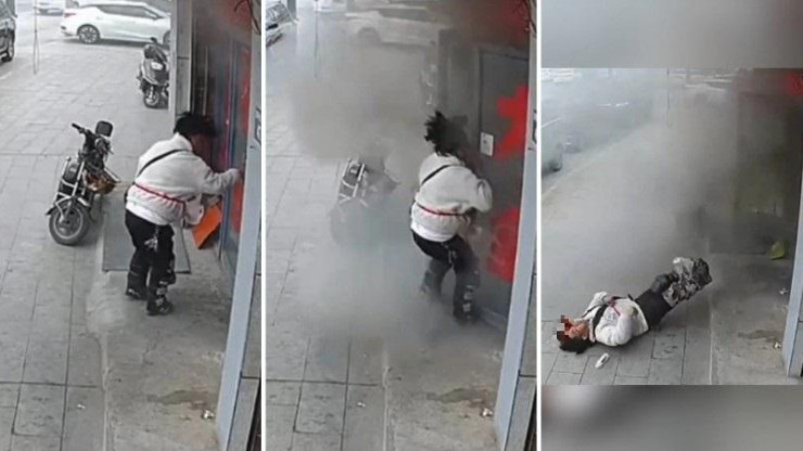 Người đàn ông cố mở cửa để cảnh báo chủ cửa hàng trước khi bị hất văng về phía sau do vụ nổ lớn. Ảnh: SCMP/ Weibo