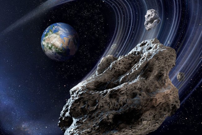 Khá nhiều tiểu hành tinh thường xuyên "hù dọa" Trái Đất - Ảnh: ASTRONOMY MAGAZINE