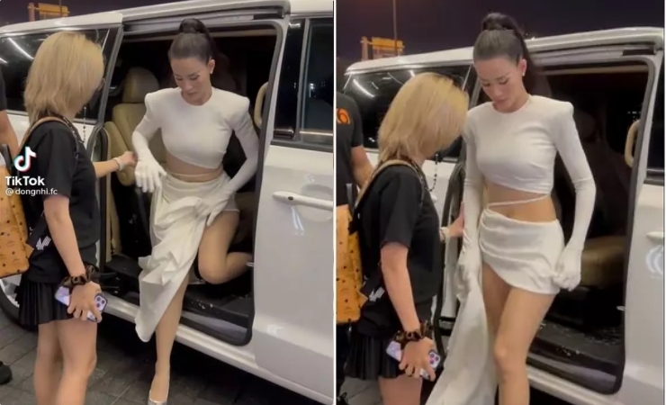 Đông Nhi chỉnh sửa tà váy khoe đôi chân thon dài. Tuy nhiên vì váy quá ngắn khiến cô luôn phải che chắn mỗi khi bước đi hay nhảy trên sân khấu.&nbsp;
