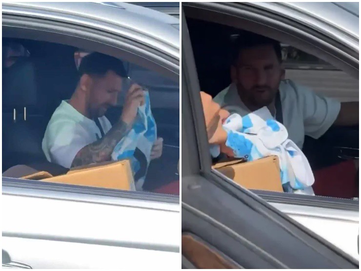 Messi ký tặng áo cho người hâm mộ khi đang dừng xe trên đường.