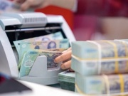 Kinh doanh - Lãi suất tiết kiệm tại nhiều ngân hàng đứng ở mức cao sau Tết