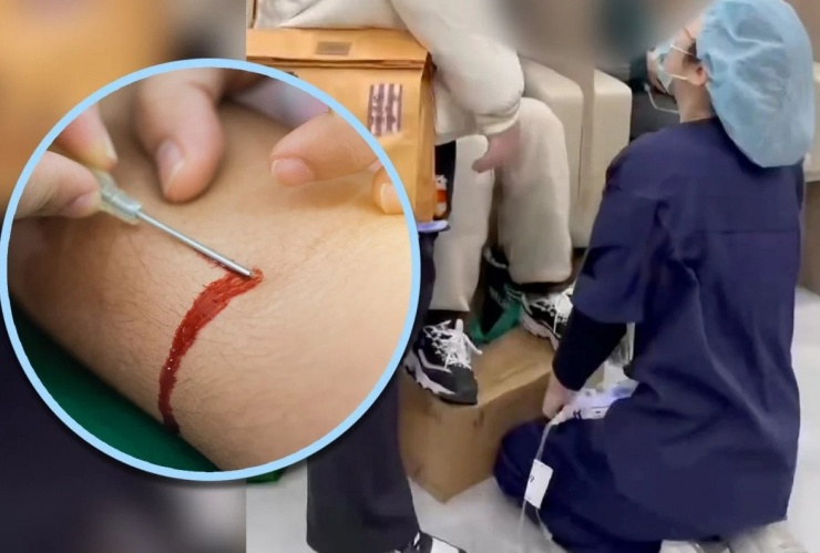 Nữ y tá quỳ gối gây tranh cãi. Ảnh: SCMP