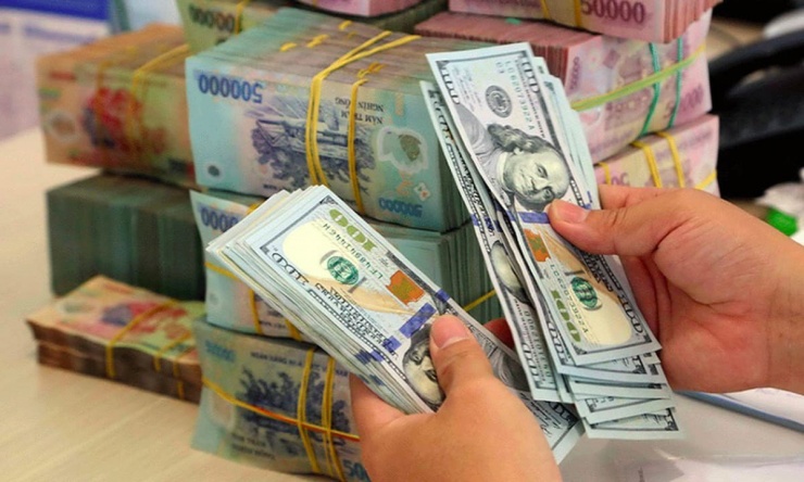 Từ ngày 9/2/2026, cá nhân mua, bán ngoại tệ không đúng quy định của pháp luật sẽ bị xử lý nghiêm, với mức phạt có thể lên tới 100 triệu đồng. Ảnh: Hoàng Mai.