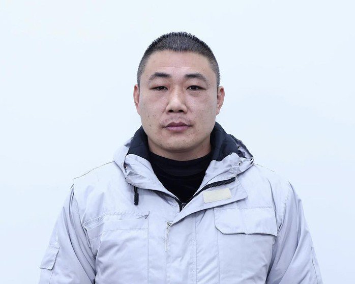 Fan Mingzhen bị bắt giữ khi đang tìm cách lẩn trốn sang Lào. Ảnh: Công an cung cấp