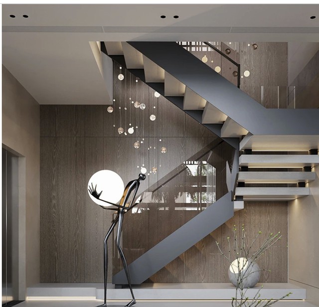 Cầu thang được thiết kế hiện đại nằm ở góc căn nhà giúp tiết kiệm diện tích không gian.