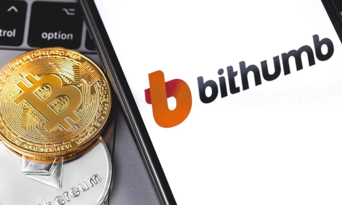 Logo sàn giao dịch tiền số Bithumb được đặt cạnh hai biểu trưng của Bitcoin và Ether. Ảnh: Primakov/Shutterstock