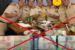 Công an khẳng định hình ảnh CSGT 'ăn mừng' bên những cọc tiền là giả mạo, cắt ghép