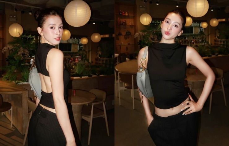 Hoa hậu Tiểu Vy diện mốt áo cut-out không nội y, kết hợp quần ống rộng đồng màu, nhấn bằng túi Dior.