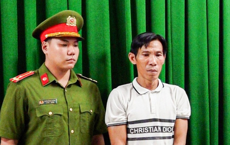 Trần Anh Tuấn tại cơ quan công an. Ảnh: TP