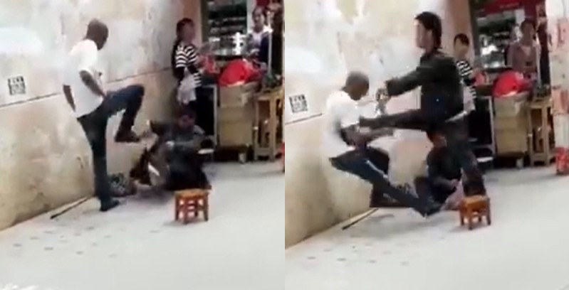 Thanh niên da màu đánh người ăn xin TQ, bị nhận cước đau đớn - 1