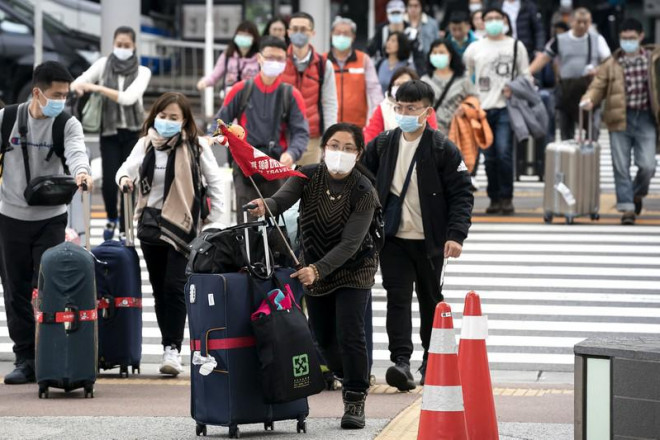 Du khách Trung Quốc tại sân bay quốc tế Narita thuộc TP Narita, Nhật hồi tháng 1. Ảnh: REUTERS