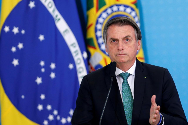 Tổng thống Brazil Jair Bolsonaro cho rằng Covid-19 chỉ là "cúm vặt". Ảnh: Reuters
