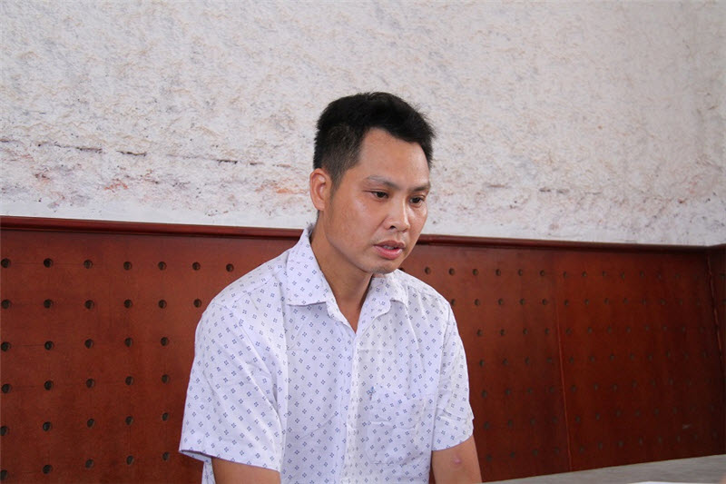 Nông Quý Dưỡng tại trụ sở công an.