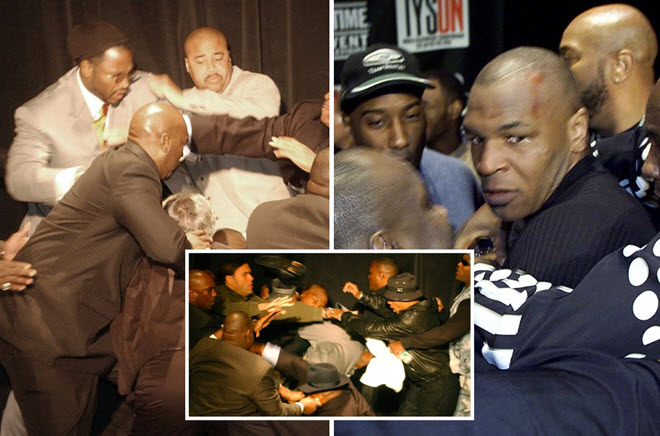 Lewis (vest xám) tung 3 cú đấm vào Tyson ở buổi họp báo năm 2002