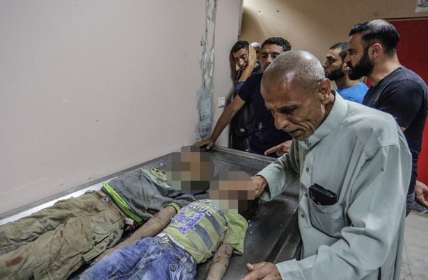 Chùm ảnh: Dải Gaza hỗn loạn sau các đợt nã rocket qua lại giữa Israel và Hamas - 8