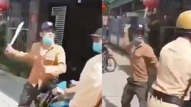 Nguyễn Quốc Nhật dùng dao dài đe dọa chém Thượng úy Nguyễn Khánh Đạt - Ảnh cắt từ clip