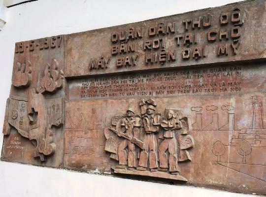 How much is the bas-relief at Project 61 Tran Phu worth that Hanoi has to speedily suspend construction?  - first