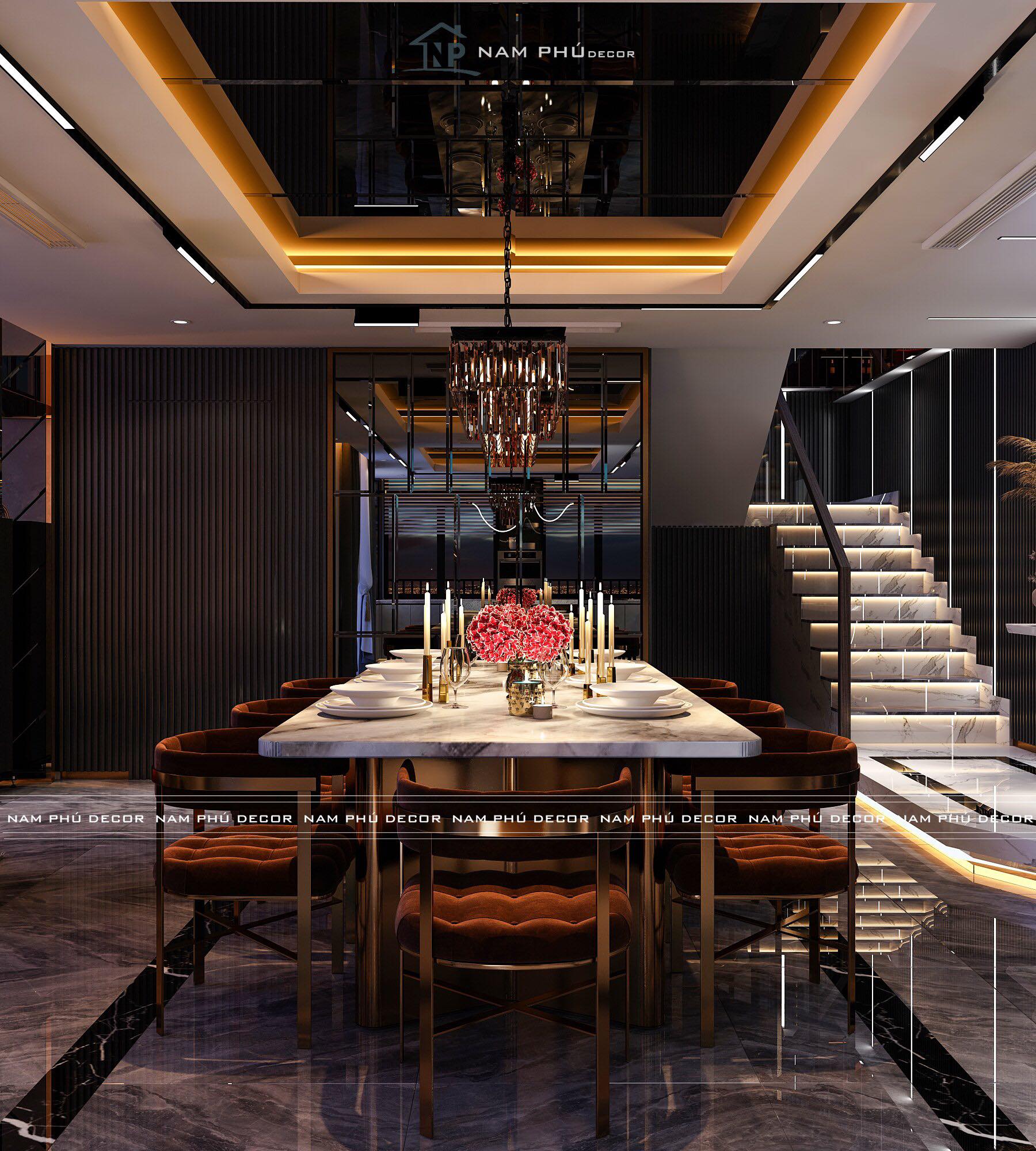 Bàn ăn với bề mặt thiết kế bằng đá và được tạo điểm nhấn bằng một chiếc đèn chùm sang trọng