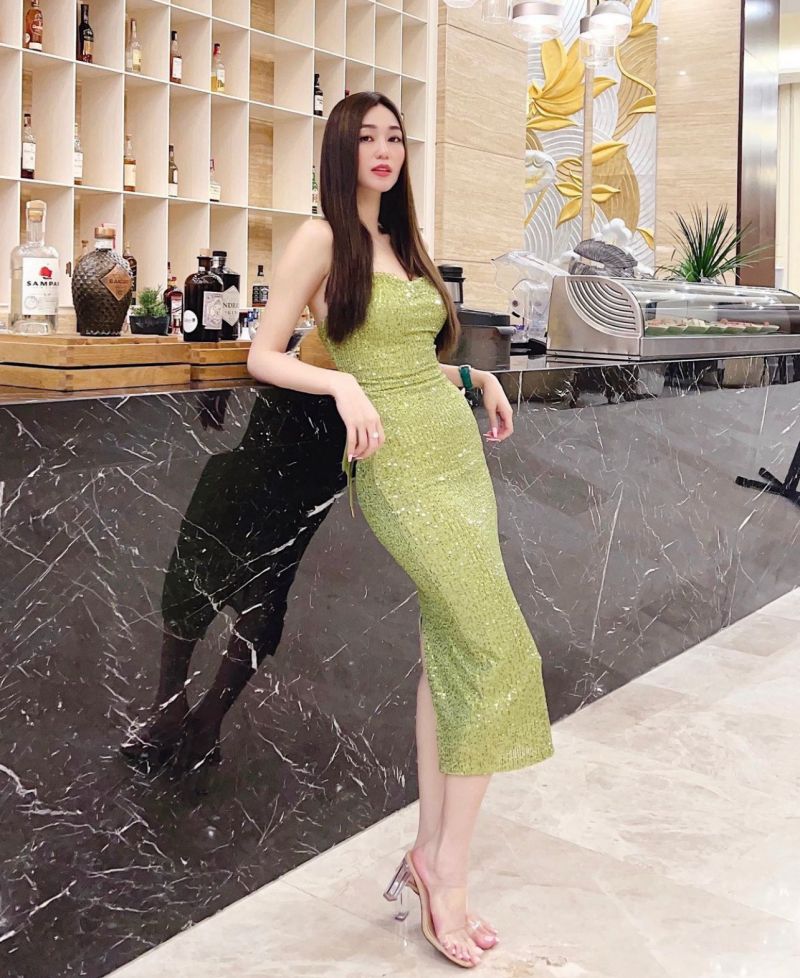 "Vietnamese beauty has a building named after her"  cleverly wearing a skirt to show off her 3rd round " the most beautiful Vbiz"  - 3