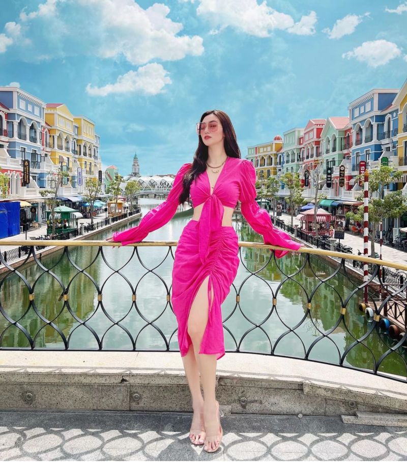 "Vietnamese beauty has a building named after her"  cleverly wearing a skirt to show off her 3rd round " the most beautiful Vbiz"  - 4