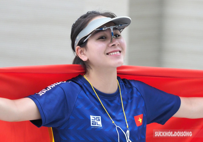 Close-up of the beautiful face of an 18-year-old female sniper who has just won a gold medal, competing at the SEA Games for the first time - 10