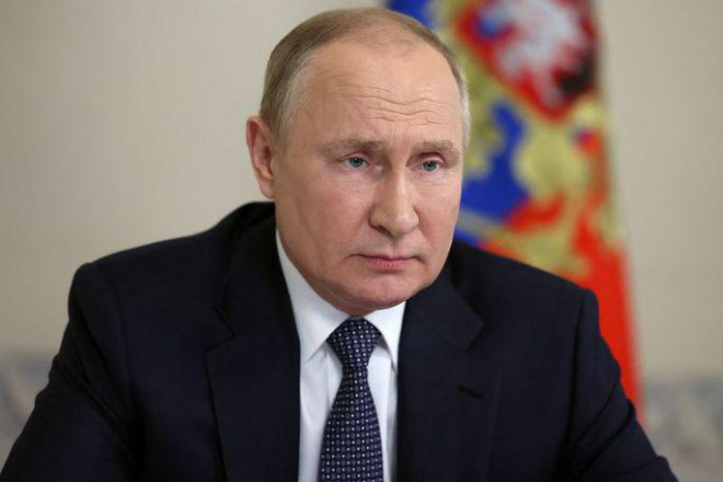 Tổng thống Nga Vladimir Putin ngày 22-6 ký sắc lệnh ban hành một quy trình tạm thời về việc thanh toán nợ công bằng ngoại tệ.. Ảnh: Reuters