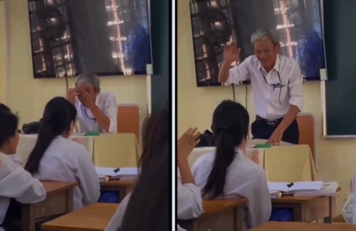 Hình ảnh thầy lấy tay lau nước mắt khi học trò hát tặng trong buổi dạy cuối cùng trước khi nghỉ hưu. Ảnh cắt ra từ clip