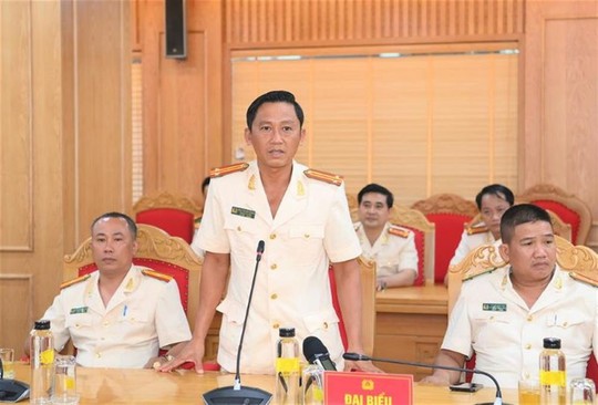 Trung tá Nguyễn Chí Thành phát biểu tại một hội nghị. Ảnh: Bộ Công an