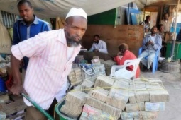 Kinh doanh - Ở quốc gia này, tiền rải đầy đường nhưng dân vẫn than nghèo