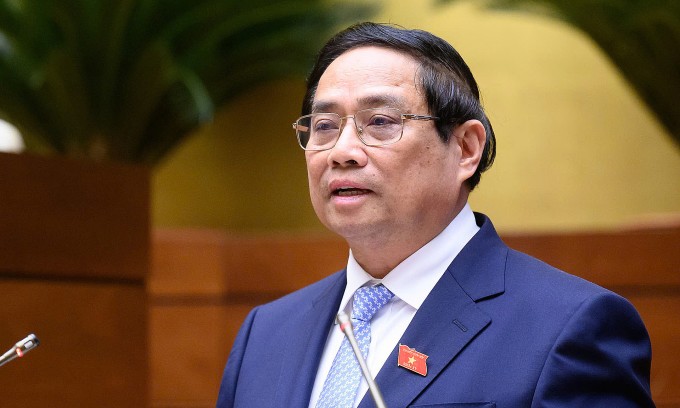 Thủ tướng Phạm Minh Chính báo cáo Quốc hội kết quả phát triển kinh tế xã hội, sáng 5/5. Ảnh: Hoàng Phong