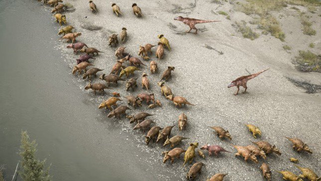 Một nhóm Gorgosaurus lùa một đàn Pachyrhinosaurus vào bờ sông như một chiến thuật săn mồi.