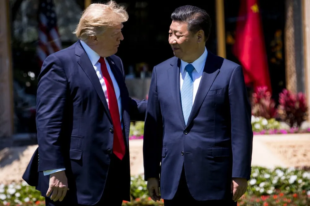 Tổng thống Mỹ Donald Trump (trái) và Chủ tịch Trung Quốc Tập Cận Bình. Ảnh: DOUG MILLS/THE NEW YORK TIMES
