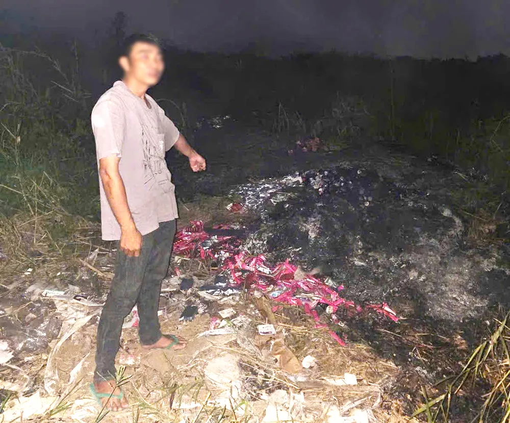 L chỉ địa điểm bỏ, đốt số thực phẩm chức năng. Ảnh: CA