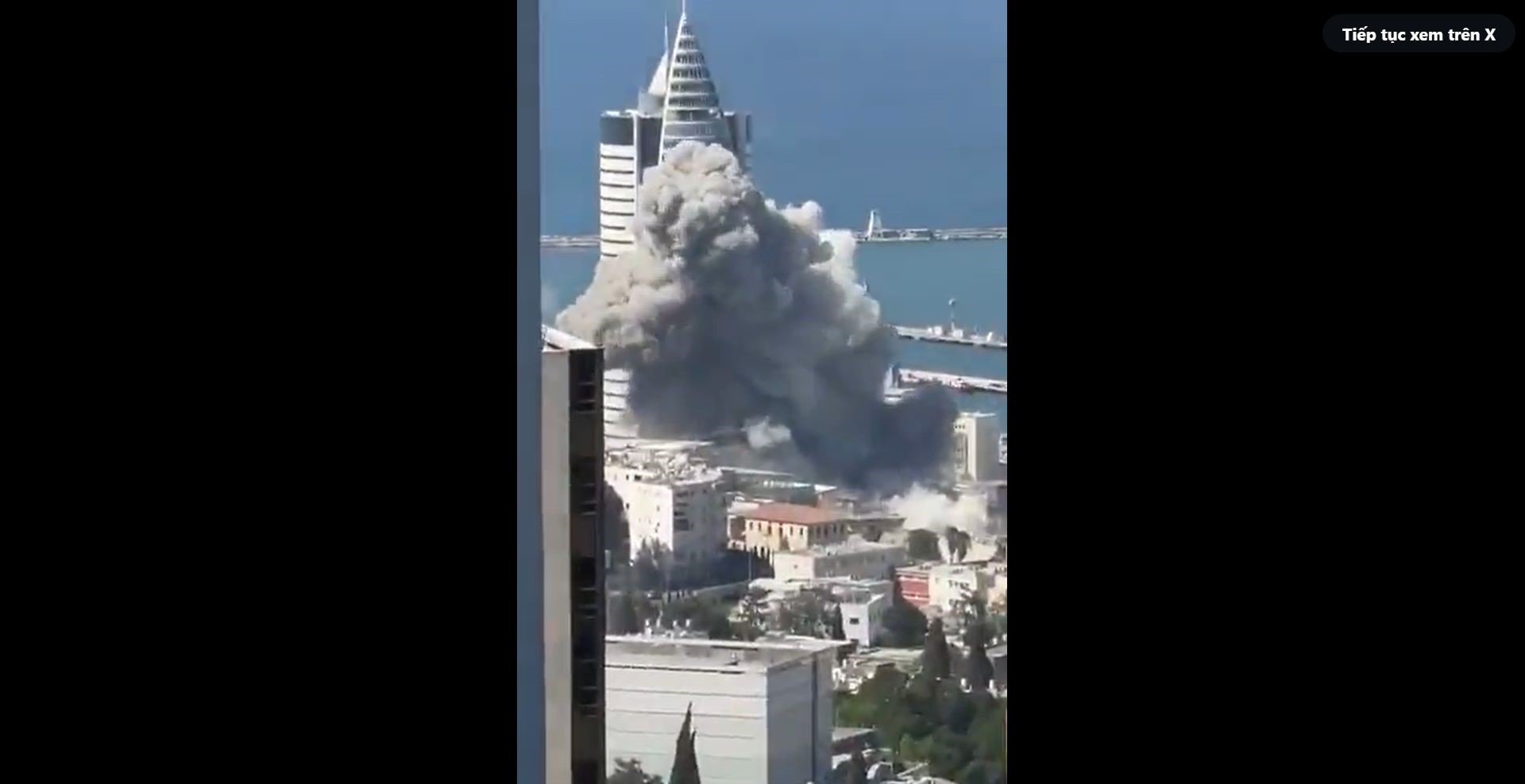 Tên lửa đánh trúng một địa điểm ở thành phố Haifa, Israel (ảnh cắt từ video)