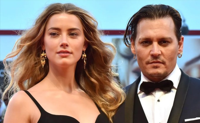 Amber Heard và Johnny Depp nảy nở tình cảm sau khi đóng cùng trong phim 'The Rum Diary' năm 2011. Ảnh: AFP