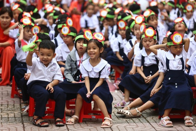 Học sinh lớp 1 trong lễ khai giảng ở trường Tiểu học Đinh Tiên Hoàng, TP Thủ Đức. Ảnh: Như Quỳnh