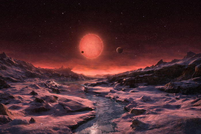 Sao lùn đỏ TRAPPIST-1 cùng 2 hành tinh TRAPPIST-1 b và TRAPPIST-1 c, nhìn từ một thế giới khác trong cùng hệ sao - Ảnh đồ họa: ESO