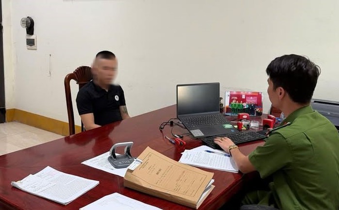 Cơ quan công an làm việc với N.V.G. Ảnh: CACC