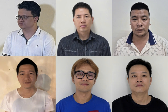Bị can Nguyễn Hải Bình (bên trái, phía trên) và 5 bị can khác tại cơ quan điều tra. Ảnh: Bộ Công an