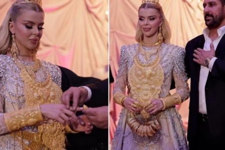 Cô dâu di chuyển khó khăn vì đeo vàng kín người trong lễ đính hôn