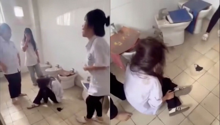Hình ảnh vụ một nữ sinh bị nhóm bạn hành hung trong khu vực nhà vệ sinh tại Trường Cao đẳng nghề Việt Xô số 1. (Ảnh cắt từ video)