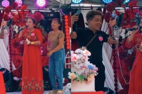 Clip dì cô dâu mang bình truyền nước lên hát đám cưới gây sốt mạng