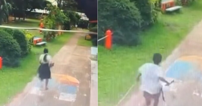 Học sinh (phải) cầm dao đuổi theo cô giáo (trái) trong khuôn viên trường. Ảnh: CCTV