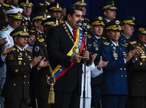 Tiết lộ &#34;sốc&#34; về nơi ẩn náu của nghi phạm ám sát hụt Tổng thống Venezuela - 1