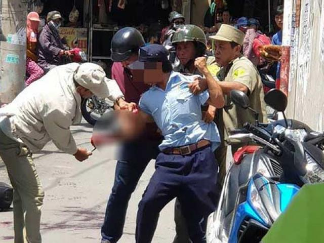 Pháp luật - Bảo vệ ngồi giữa chợ dùng dao tự sát